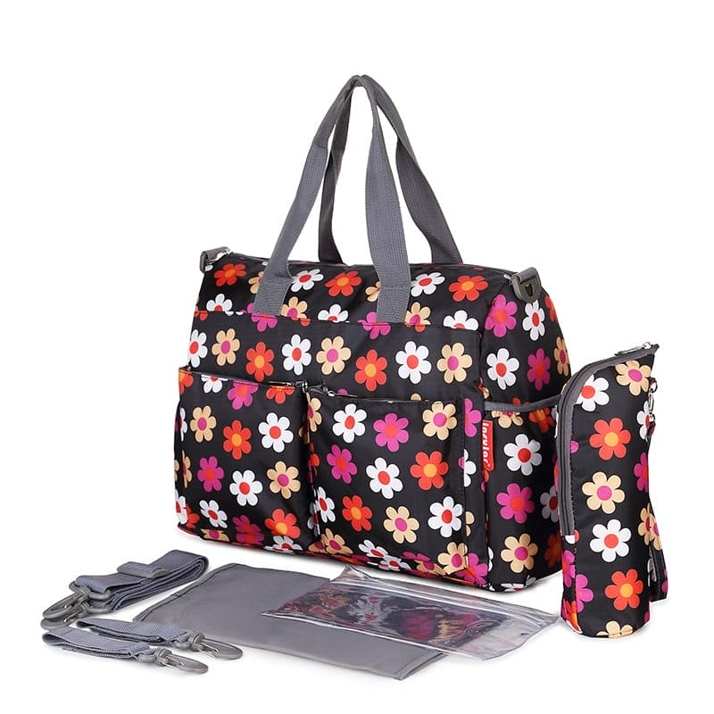 Modische multifunktionale Wickeltasche mit farbenfrohem Blumenmuster, wasserdicht, inklusive Wickelunterlage und Tragegurt für stilbewusste Eltern.