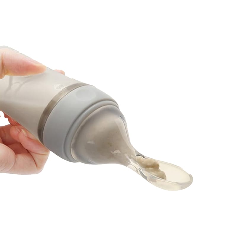 Baby-Silikon-Quetschflasche mit Löffelaufsatz für bequemes Füttern von Brei.